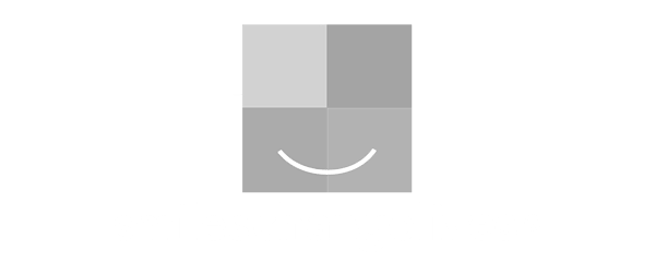 Smiles Change Lives logo white
